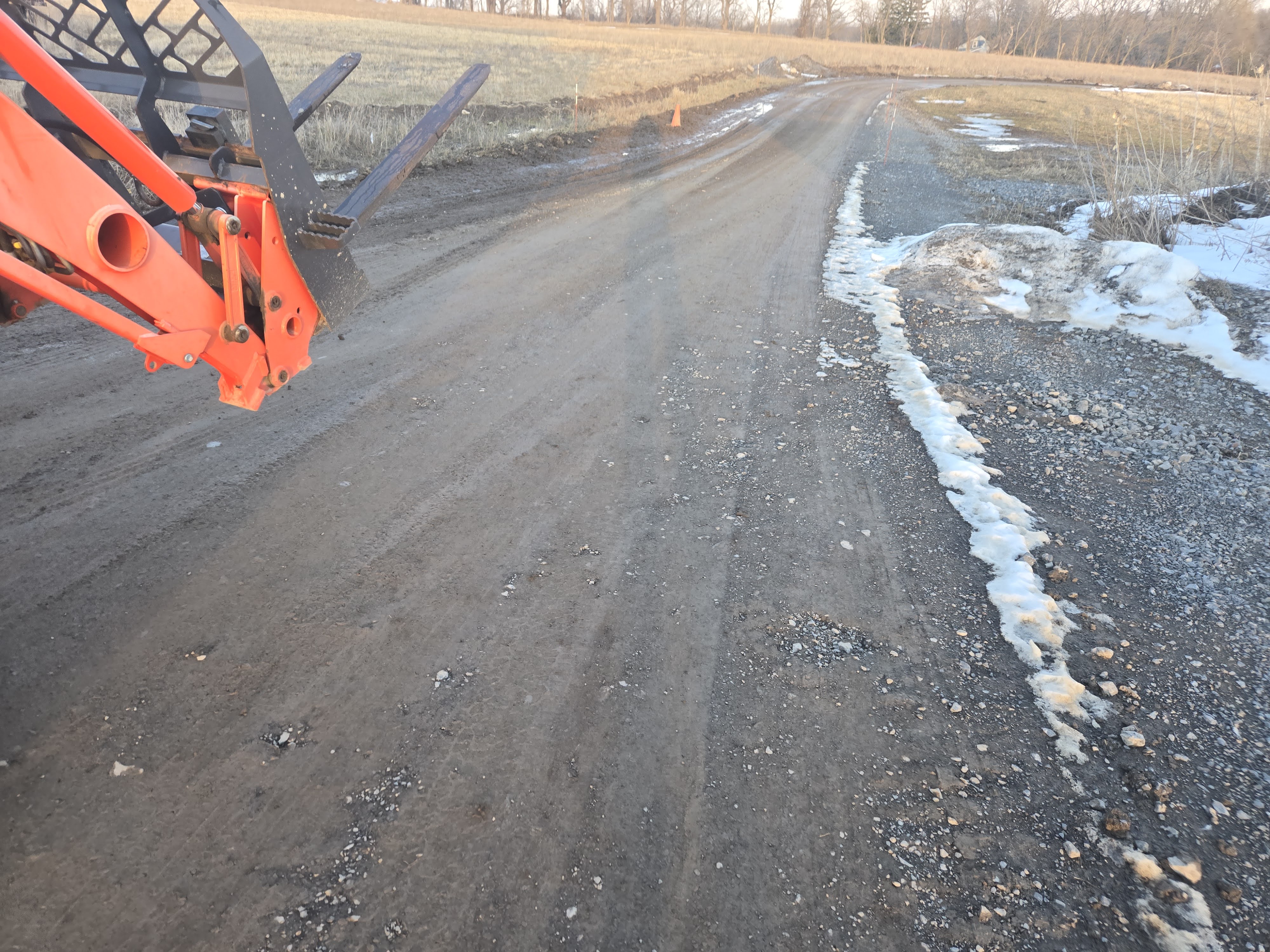 1,600 ft residential driveway before regrading - rutted and in poor condition